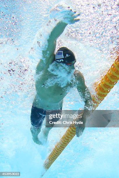 Michael Phelps of the USA swims the Men's 100m Freestyle Final during day two of the 2014 Pan Pacific Championships at Gold Coast Aquatics on August...