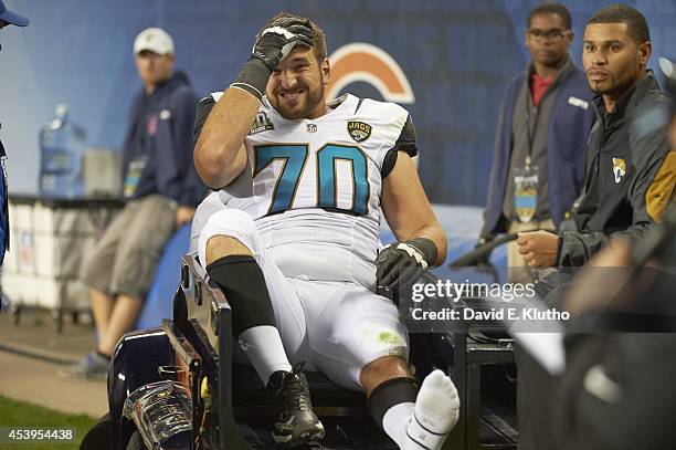 Jacksonville Jaguars Luke Bowanko being carted off of field after sustaining injury during preseason game vs Chicago Bears at Soldier Field. Chicago,...