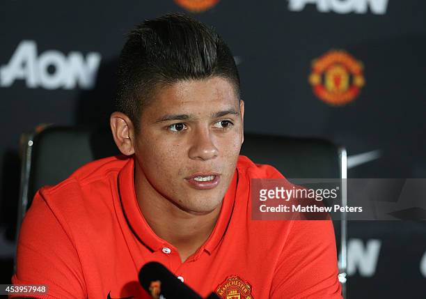 Marcos Rojo of Manchester United speaks at a press conference to unveil him as the club's new signing at Aon Training Complex on August 22, 2014 in...