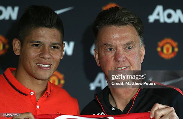 Manager Louis van Gaal of Manchester United poses with Marcos Rojo after a press conference to unveil new signing Marcos Rojo at Aon Training Complex...