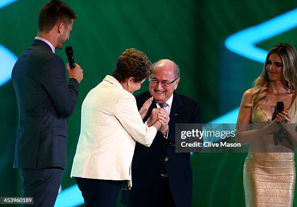 President Joseph S. Blatter greets Brazil President Dilma Rousseff on stage next to host Fernanda Lima and Rodrigo Hilbert before the Final Draw for...