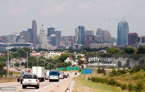 Traffic drives south on Interstate 75 into downtown Cincinnati, Ohio, U.S., on Tuesday, Aug. 19, 2014. The U.S. Economy will expand 3 percent in the...