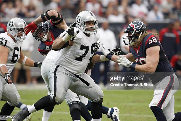 Tony Pashos of the Oakland Raiders blocks Brooks Reed of the Houston Texans on November 17, 2013 at Reliant Stadium in Houston, Texas. Raiders won 28...