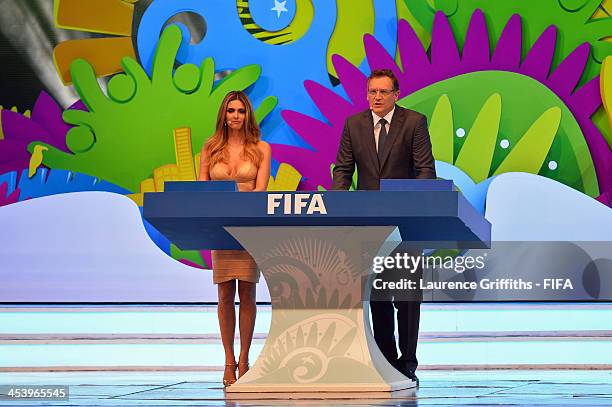 Hosts Fernanda Lima and FIFA Secretary General Jerome Valcke speak to the audience before the Final Draw for the 2014 FIFA World Cup Brazil at Costa...