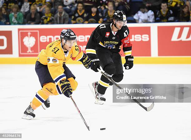 Jesse Virtanen of Lukko breaks from Martin Podlesak of Nottingham Panthers during the Champions Hockey League group stage game between Nottingham...
