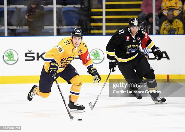 Jesse Virtanen of Lukko breaks from Martin Podlesak of Nottingham Panthers during the Champions Hockey League group stage game between Nottingham...