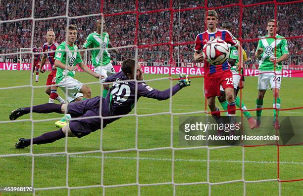 Max Grun of VfL Wolfsburg fails to stop Arjen Robben of Bayern Muenchen scoring their second goal during the Bundesliga match between FC Bayern...