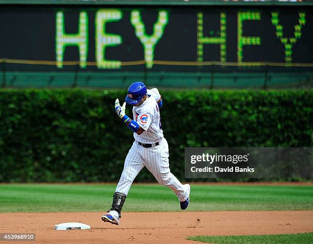 Luis Valbuena of the Chicago Cubs runs the bases after hitting a home run against the Baltimore Orioles during the fourth inning on August 22, 2014...