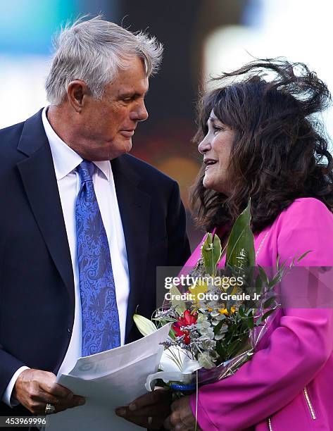 Lou Piniella , former manager of the Seattle Mariners, and his wife Anita share a moment during ceremonies inducting him into the Seattle Mariners'...