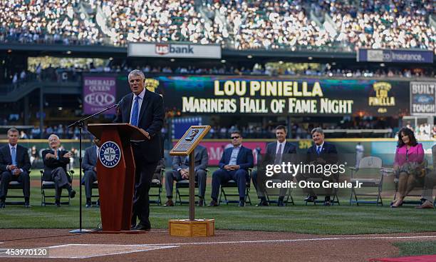 Lou Piniella, former manager of the Seattle Mariners, speaks to the crowd during ceremonies inducting him into the Seattle Mariners' Hall of Fame...