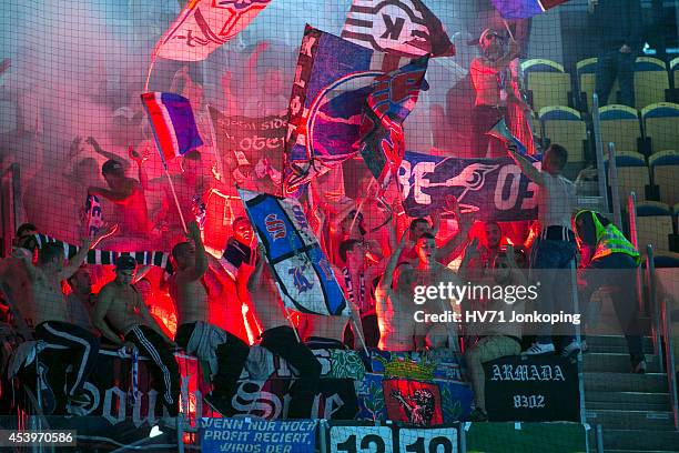 Fans from Kloten Flyers lighten some bengals in the end during the Champions Hockey League group stage game between HV71 Jonkoping and Kloten Flyers...