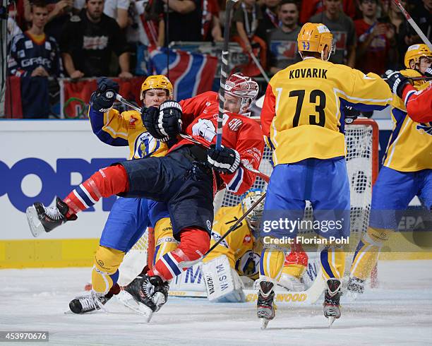 Pavel Sedlacek of PSG Zlin sends T.J. Mulock of Eisbären Berlin flying during the Champions Hockey League group stage game between Eisbaeren Berlin...