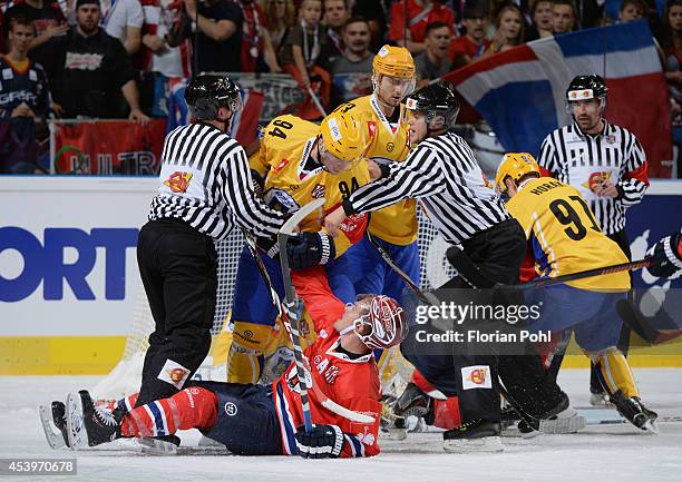 Pavel Sedlacek of PSG Zlin and T.J. Mulock of Eisbären Berlin fight during the Champions Hockey League group stage game between Eisbaeren Berlin and...