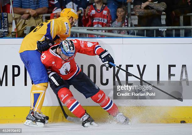 Barry Tallackson of Eisbären Berlin and Tomas Zizka of PSG Zlin body check during the Champions Hockey League group stage game between Eisbaeren...