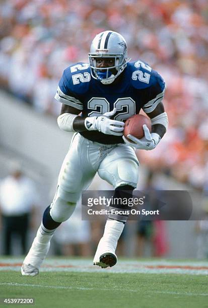 Running Back Emmitt Smith of the Dallas Cowboys carries the ball during the NFL Football game circa 1990. Smith played for the Cowboys from 1990-02.