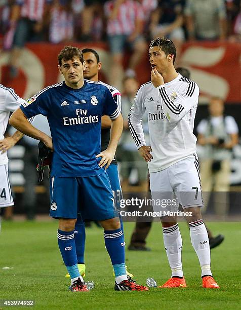 Iker Casillas and Cristiano Ronaldo of Real Madrid look dejected after the Supercopa second leg match between Atletico de Madrid and Real Madrid at...