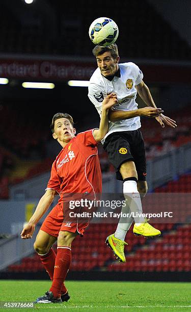 Harry Wilson of Liverpool and Joe Rothwell of Manchester United in action during the Barclays Premier League Under 21 fixture between Liverpool and...