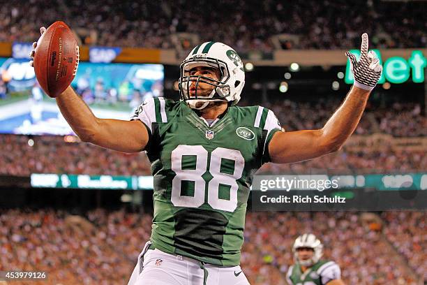 Tight end Jace Amaro of the New York Jets celebrates a touchdown reception in the second quarter of a preseason game against the New York Giants at...