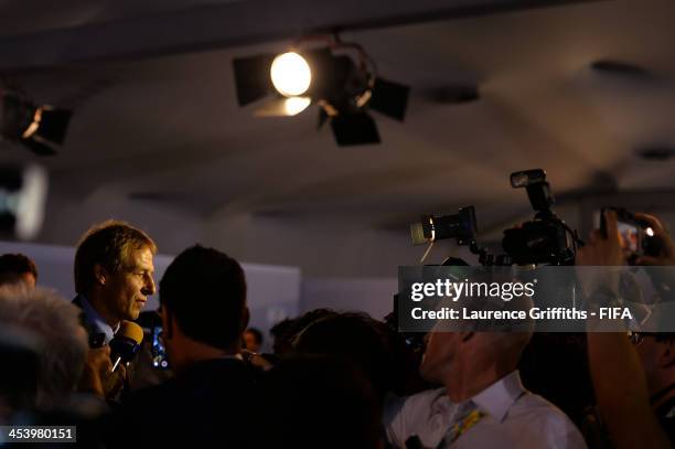 Coach Juergen Klinsmann speaks to members of the media after the Final Draw for the 2014 FIFA World Cup Brazil at Costa do Sauipe Resort on December...