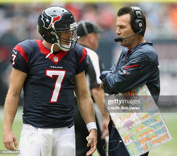 Case Keenum of the Houston Texans talks with head coach Gary Kubiak at Reliant Stadium on December 1, 2013 in Houston, Texas.