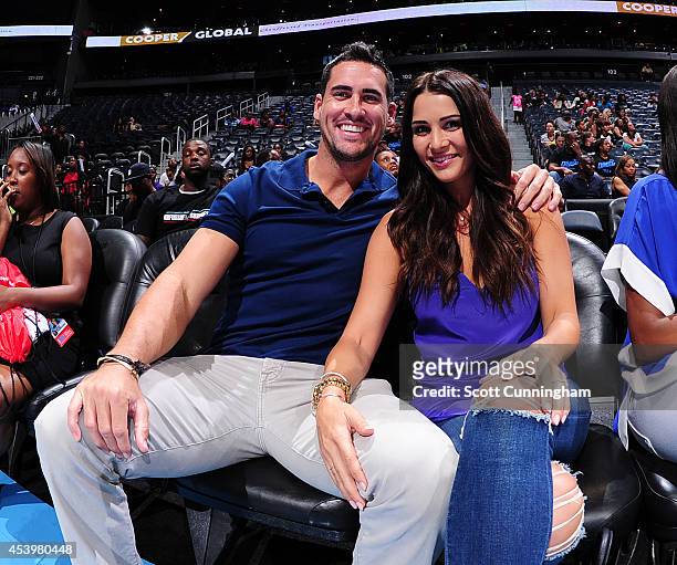 Bachelorette Star Andi Dorfman poses with fiancee Josh Murray during the game between the Atlanta Dream and the Chicago Sky in Game One of the...