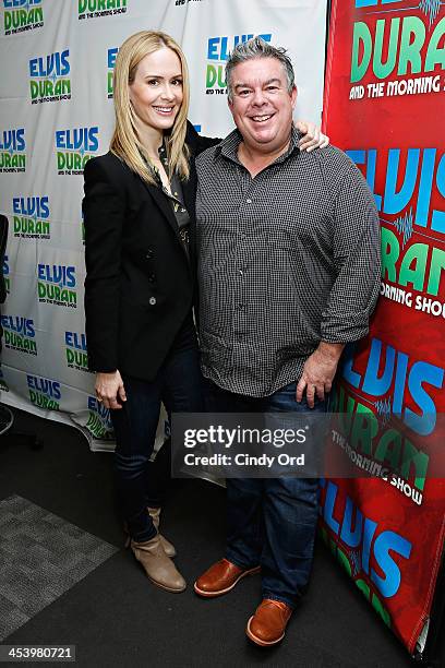 Actress Sarah Paulson poses with host Elvis Duran during a visit to the Elvis Duran Z100 Morning Show at Z100 Studio on December 6, 2013 in New York...