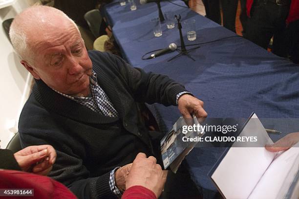George Schindler autographs books during the launching of the book "La Lista de Schindler Chileno" , written by Manuel Salazar Salvo on his life, in...