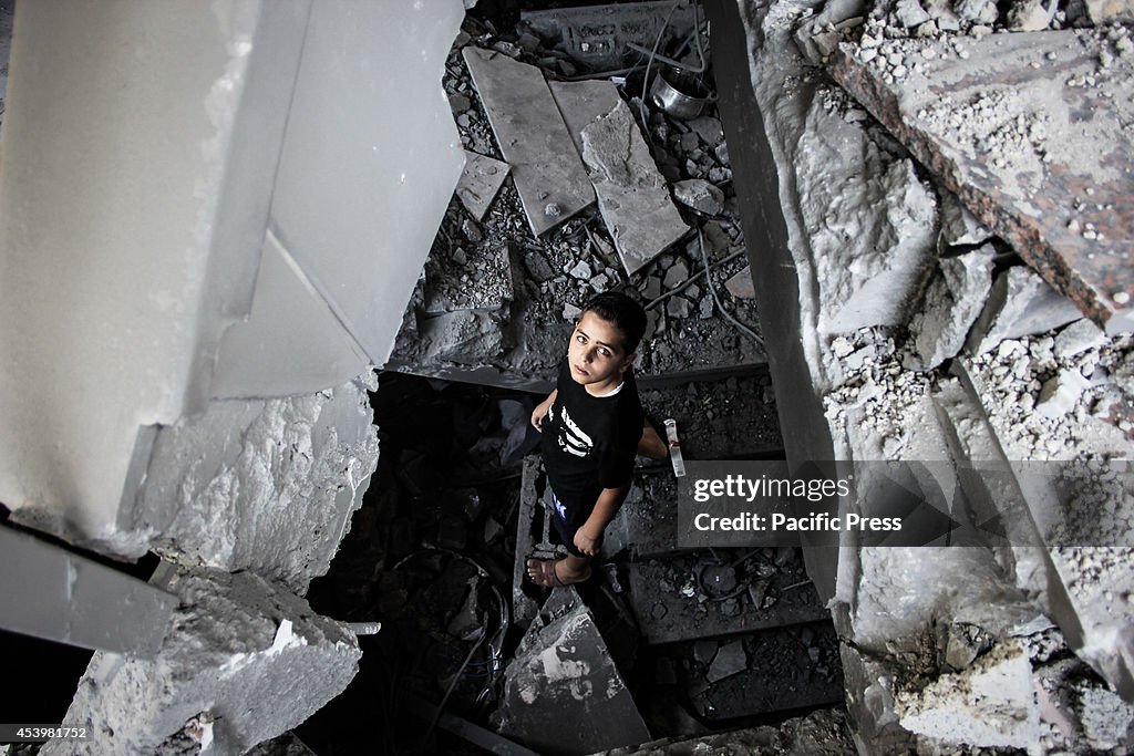 A Palestinian boy  inside the devastated al- Ameen Mohammed...