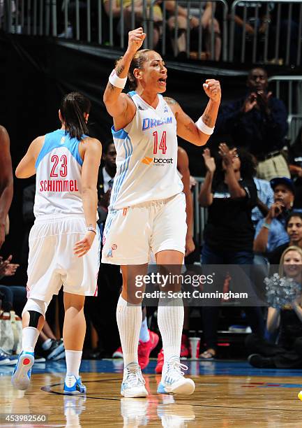 Erika deSouza of the Atlanta Dream celebrates after a score against the Chicago Sky in Game One of the Eastern Conference Semifinals during the 2014...