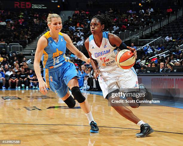 Tiffany Hayes of the Atlanta Dream drives against Allie Quigley of the Chicago Sky in Game One of the Eastern Conference Semifinals during the 2014...