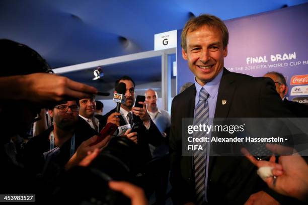 Coach Juergen Klinsmann speaks to members of the media after the Final Draw for the 2014 FIFA World Cup Brazil at Costa do Sauipe Resort on December...