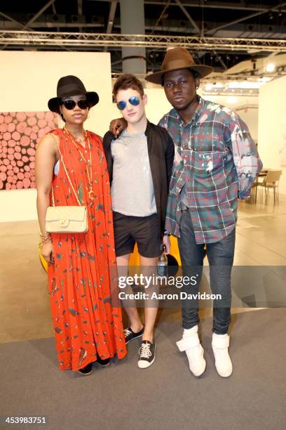 Kim Ntsimi, Harry Brant and rapper Theophilus London attend Art Basel Miami Beach 2013 at the Miami Beach Convention Center on December 6, 2013 in...