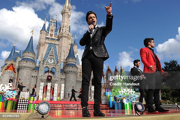 In this handout photo provided by Disney Parks, Italian pop vocal trio IL VOLO performs "Feliz Navidad" while taping the Disney Parks Christmas Day...