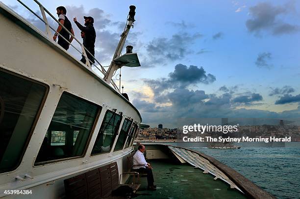 Men gather on the deck of the Turkish ship, MV Mavi Marmara, which is docked in the Port of Istanbul, Turkey, on the fourth anniversary of the Gaza...