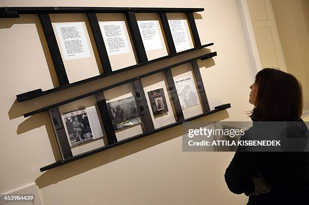 Visitor looks at displayed items of the life of Hungarian-born US photographer Robert Capa at an exhibition in the Hungarian National Museum in...