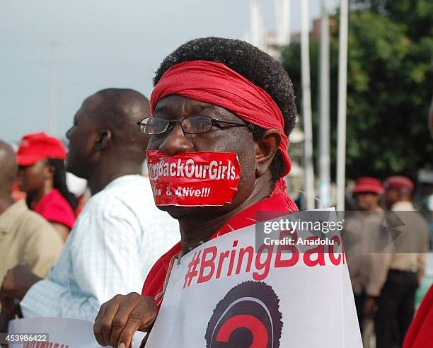 Protestor marches under ''Bring back our girls'' campaign for the missing Nigerian girls in Abuja, Nigeria on August 22, 2014. On April 14, Boko...