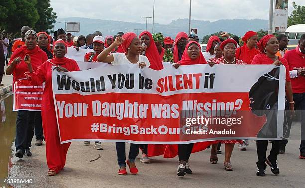 Protestors march by shouting slogans under ''Bring back our girls'' campaign for the missing Nigerian girls in Abuja, Nigeria on August 22, 2014. On...