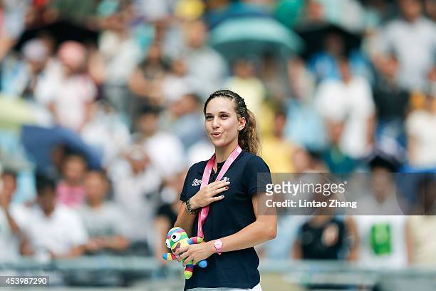 Laura Valette of France celebrates during the medal ceremony after the Women's 100m Hurdles Final of Nanjing 2014 Summer Youth Olympic Games at the...
