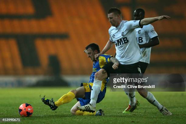 Jamie White of Salisbury City in action with Chris Robertson of Port Vale during the FA Cup Second Round match between Port Vale and Salisbury City...