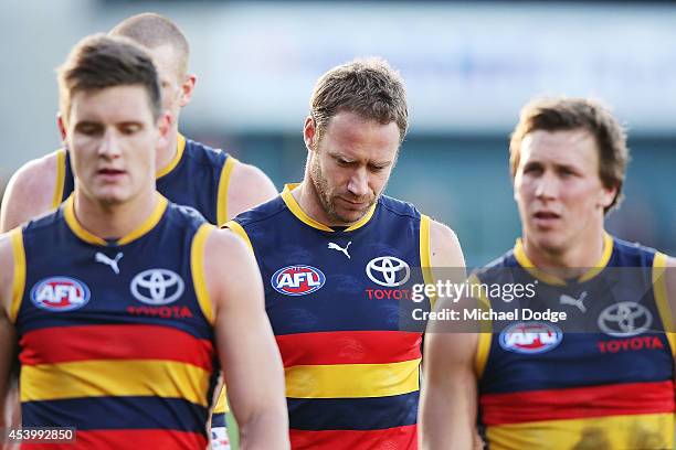 Ben Rutten of the Crows walks off the ground after defeat during the round 22 AFL match between the North Melbourne Kangaroos and the Adelaide Crows...