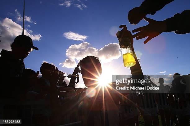 Lindsay Thomas of the Kangaroos celebrates the win with fans during the round 22 AFL match between the North Melbourne Kangaroos and the Adelaide...