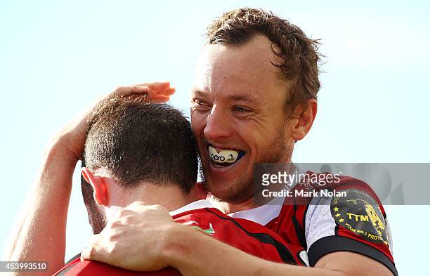 Jesse Mogg of the Vikings congratulates team mate Robbie Coleman after he scored during the round one National Rugby Championship match between the...