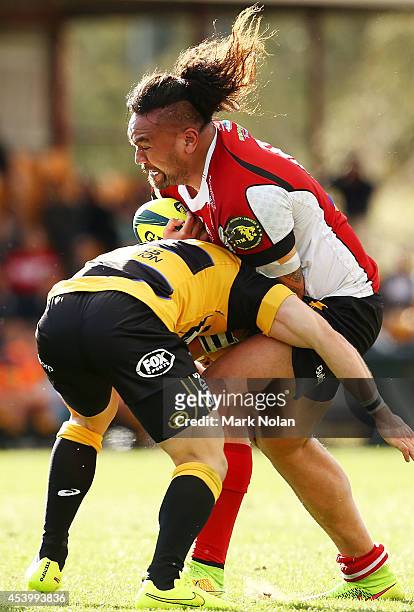 Fotu Auelua of the Vikings is tackled during the round one National Rugby Championship match between the Canberra Vikings and Perth Spirit at Viking...