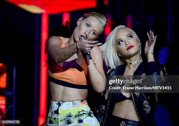 Recording artist Iggy Azalea and Singer Rita Ora perform onstage during a 2014 "MTV Video Music Awards" concert with Sam Smith And Iggy Azalea...