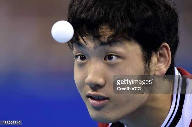 Yuto Muramatsu of Japan competes in the Mixed International Team Semifinal 2 at Wutaishan Gymnasium during day seven of the Nanjing 2014 Summer Youth...