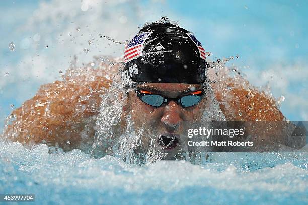 Michael Phelps of the United States swims in the Men's 100m Butterfly Final during day three of the 2014 Pan Pacific Championships at Gold Coast...