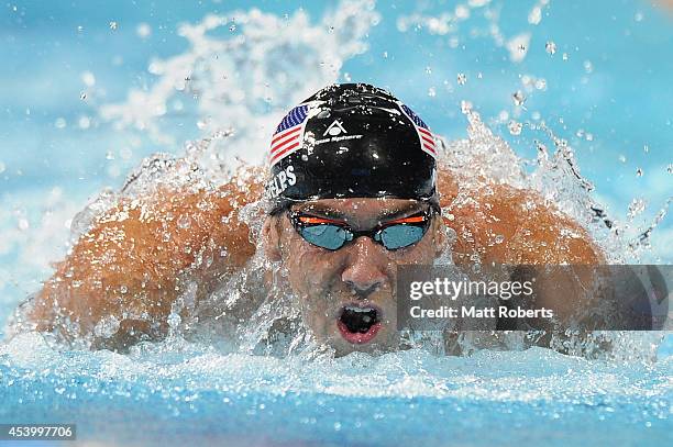 Michael Phelps of the United States swims in the Men's 100m Butterfly Final during day three of the 2014 Pan Pacific Championships at Gold Coast...
