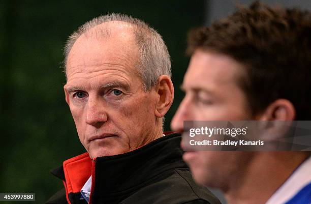 Coach Wayne Bennett and Knights captain Kurt Gidley talk at a post match press conference after the round 24 NRL match between the Brisbane Broncos...