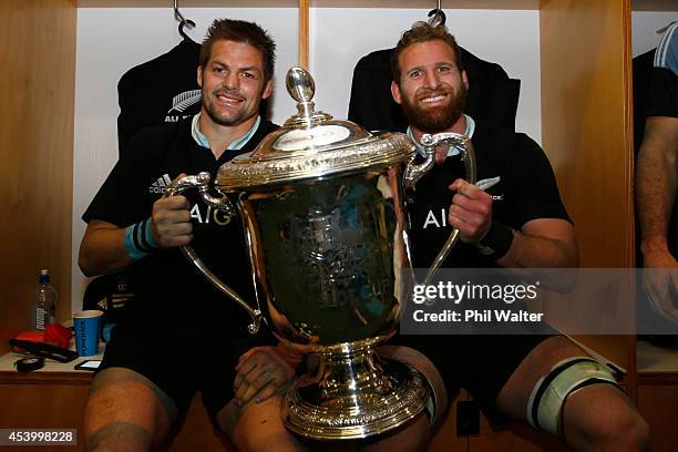 Richie McCaw and Kieran Read of the All Blacks hold the Bledisloe Cup in the dressing room following The Rugby Championship match between the New...