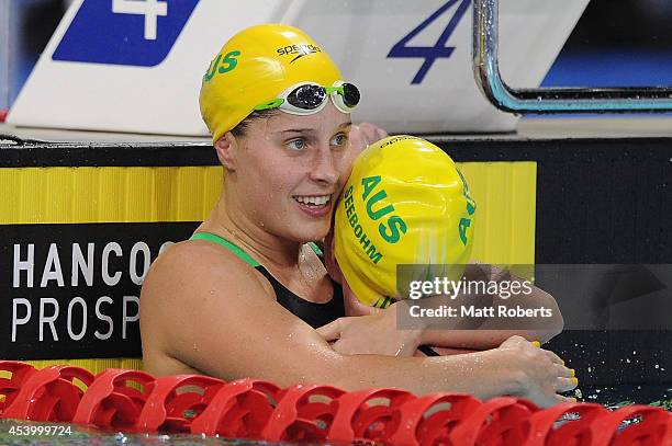 Belinda Hocking of Australia celebrates winning the Women's 200m Backstroke Final with Emily Seebohm during day three of the 2014 Pan Pacific...